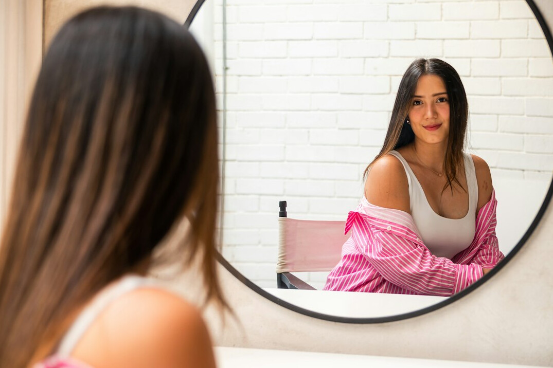woman practicing speech in mirror