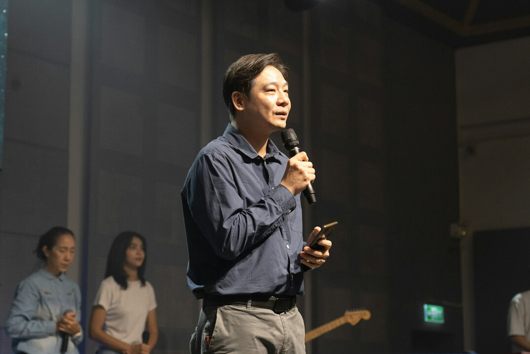 confident person speaking on stage