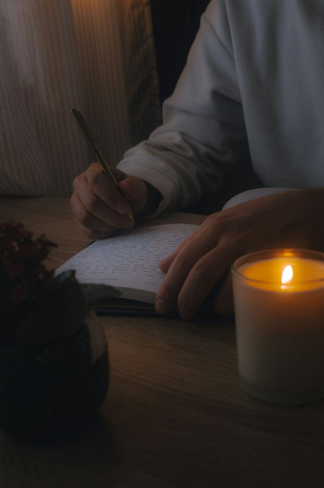 person writing goals in journal