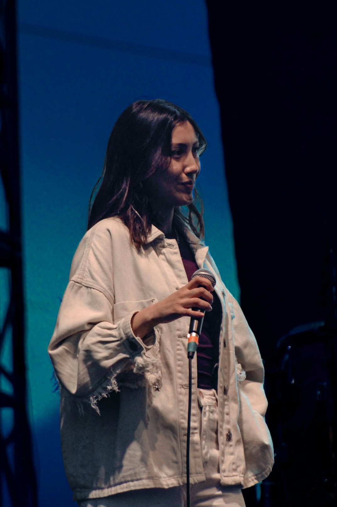 confident person speaking on stage